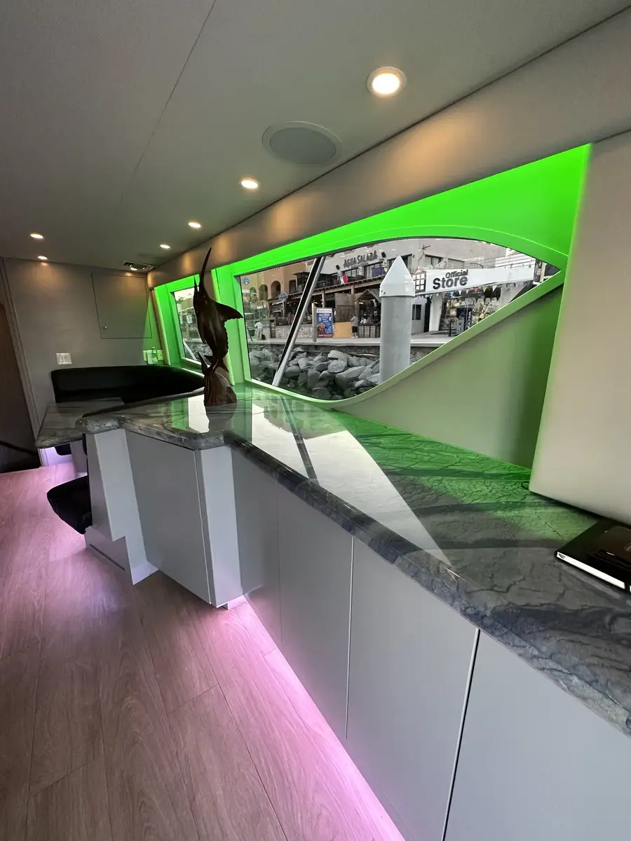 Salon counter with custom LED accents and marina view