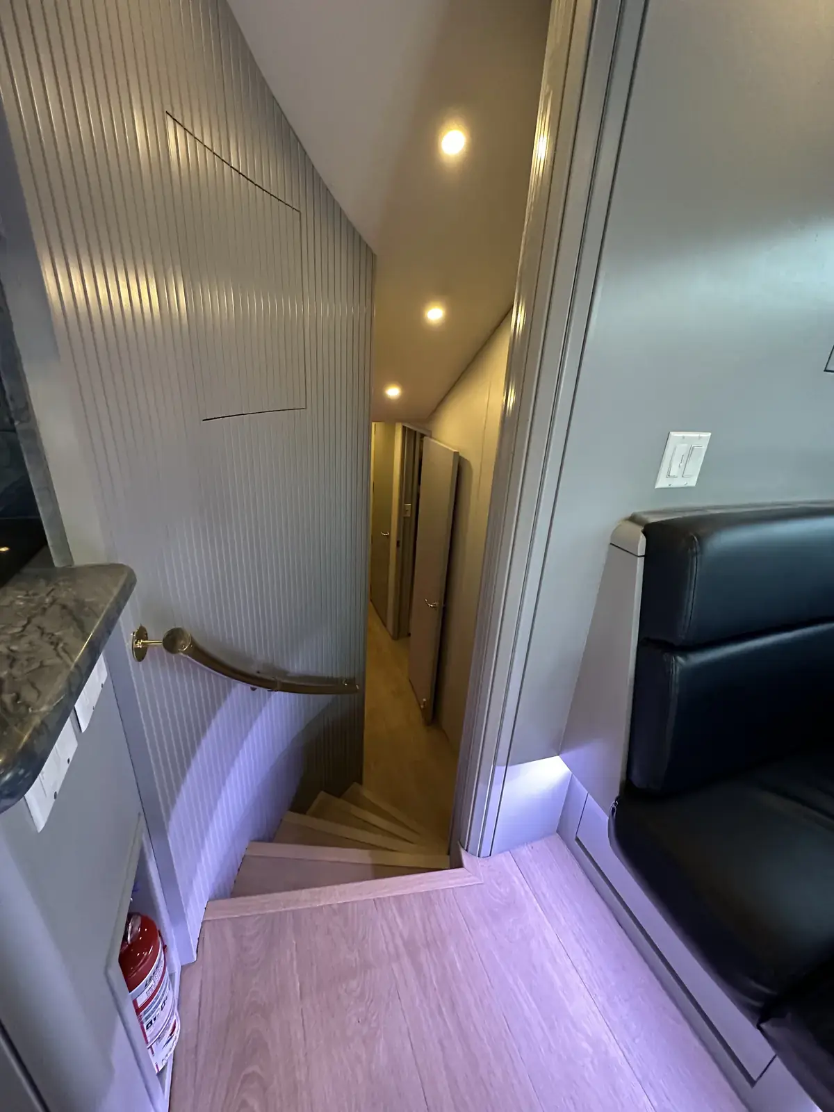 Companionway stairs from the salon down to cabins and heads on Lion Heart