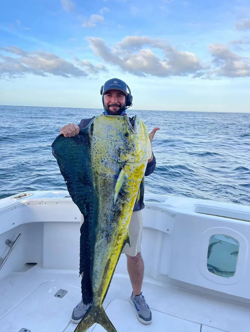 Family and Lion Heart crew with trophy sailfish on full day fishing charter